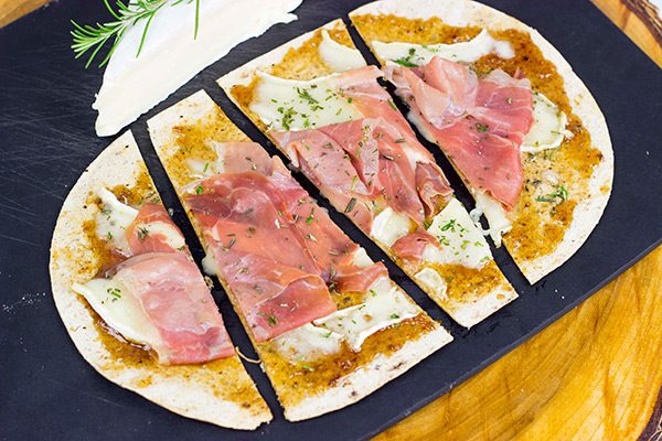 Step up your snack time with these easy Brie and Fig Jam Flatbreads!