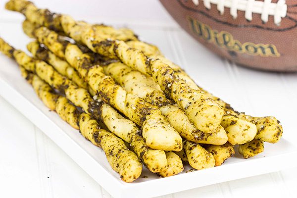 These Garlic Pesto Breadsticks are a fun and tasty snack...perfect for football games on cold winter weekends!