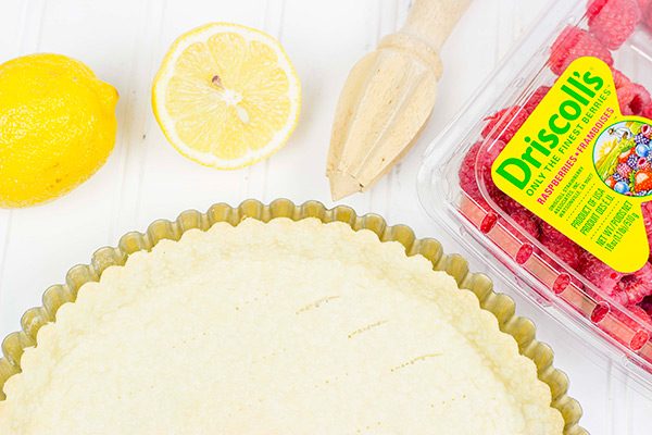 Featuring a light, lemony base and topped with fresh raspberries, this Lemon Raspberry Mascarpone Tart is bound to be a new holiday favorite in your house!