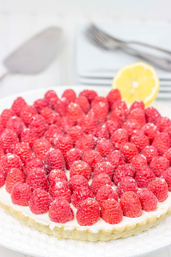 Featuring a light, lemony base and topped with fresh raspberries, this Lemon Raspberry Mascarpone Tart is bound to be a new holiday favorite in your house!