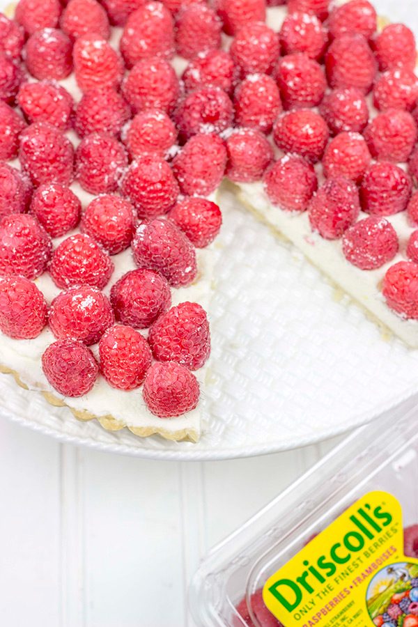 Featuring a light, lemony base and topped with fresh raspberries, this Lemon Raspberry Mascarpone Tart is bound to be a new holiday favorite in your house!