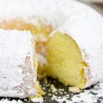 This Powdered Sugar Doughnut Cake is a throwback to Saturday morning cartoons and powdered sugar doughnuts!