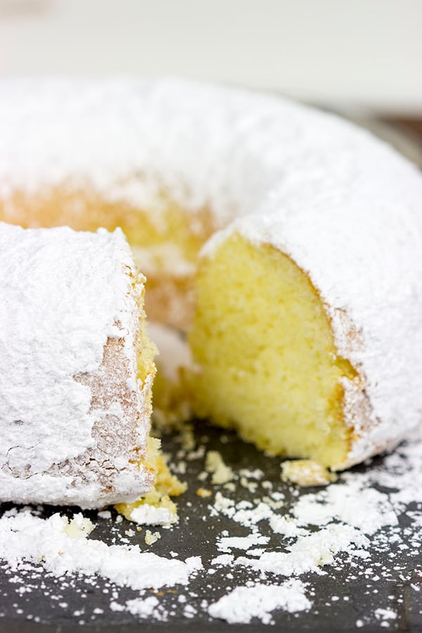 This Powdered Sugar Doughnut Cake is a throwback to Saturday morning cartoons and powdered sugar doughnuts!