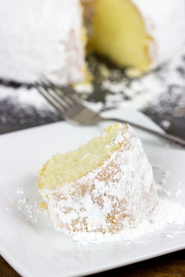 This Powdered Sugar Doughnut Cake is a throwback to Saturday morning cartoons and powdered sugar doughnuts!