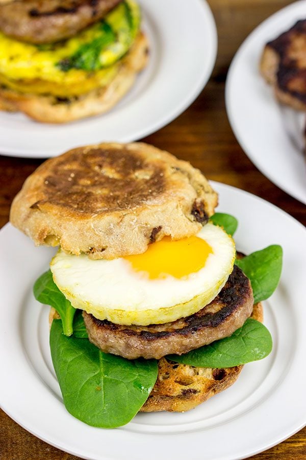 Making breakfast for a crowd?  Kitchen hack: Bake eggs in muffin tins to save time!  These Sausage and Egg Muffin Sandwiches are a favorite around our house!