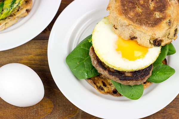 Making breakfast for a crowd?  Kitchen hack: Bake eggs in muffin tins to save time!  These Sausage and Egg Muffin Sandwiches are a favorite around our house!