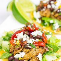 These Pulled Pork Tostadas are a quick and easy way to break out of the boring dinner routine!