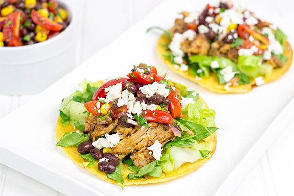 These Pulled Pork Tostadas are a quick and easy way to break out of the boring dinner routine!