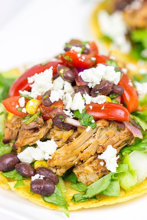 These Pulled Pork Tostadas are a quick and easy way to break out of the boring dinner routine!
