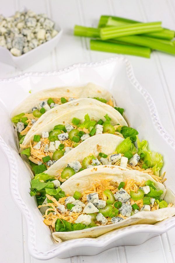 Slow Cooker Buffalo Chicken Tacos. Easy, epic football food!