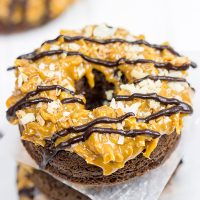 Chocolate doughnuts topped with caramel and coconut, these Baked Samoa Doughnuts will be a huge hit in your house!