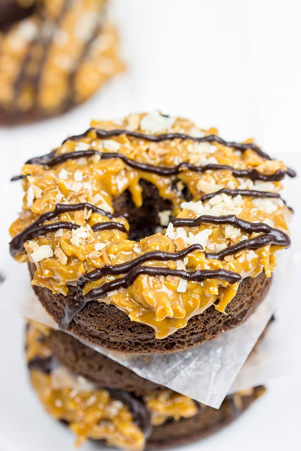 Chocolate doughnuts topped with caramel and coconut, these Baked Samoa Doughnuts will be a huge hit in your house!