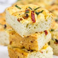 Need a unique and tasty appetizer? Give this Cheesy Spinach and Sundried Tomato Focaccia a try! (Just don't eat it all before the party...)