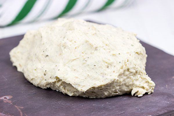 Need a unique and tasty appetizer? Give this Cheesy Spinach and Sundried Tomato Focaccia a try! (Just don't eat it all before the party...)