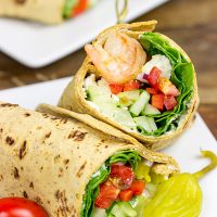 Wrap up dinner tonight with these tasty Greek Salad Wraps with Shrimp!