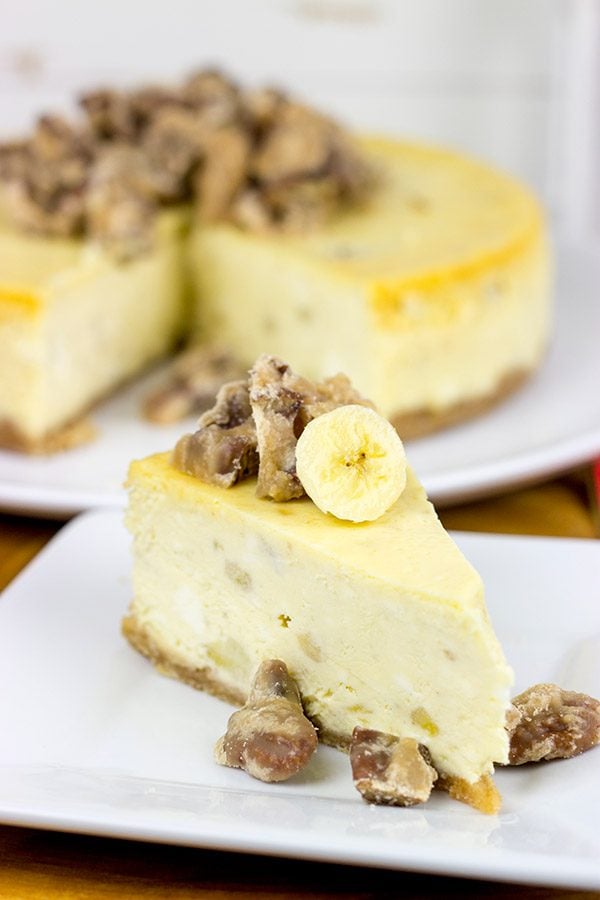 A cross between banana pudding and cheesecake, this Banana Cheesecake with Crumbled Pralines is the perfect summertime dessert!