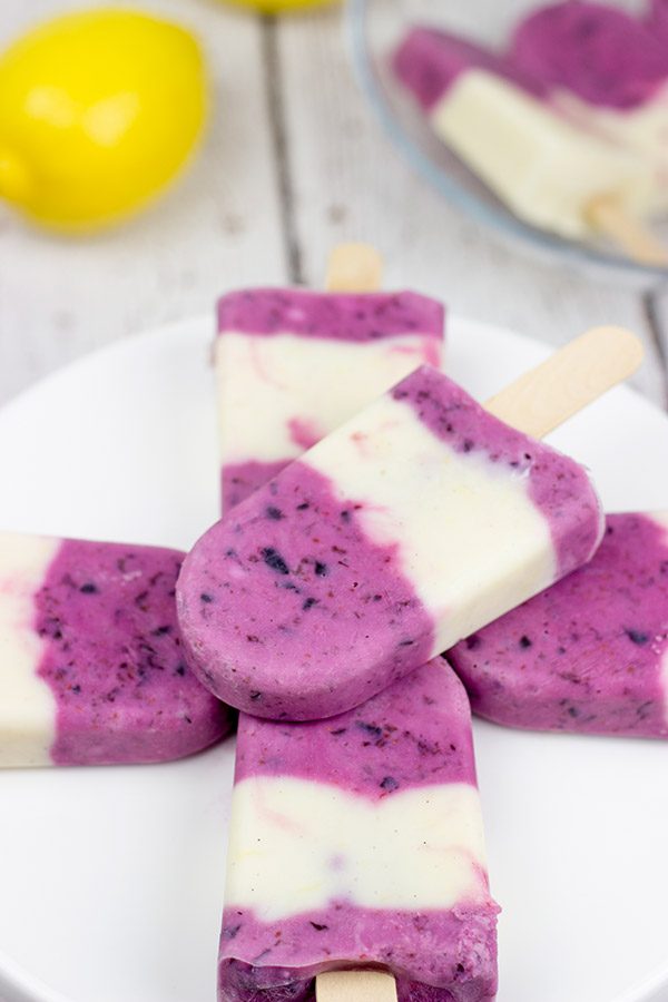 Ah, summer! Grab one of these Lemon Blueberry Popsicles and enjoy the warm sunshine in the backyard!