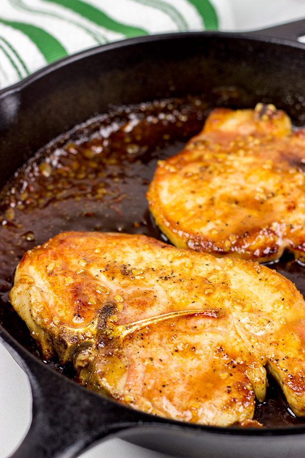 Maple Chipotle Glazed Pork Chops are an easy weeknight meal, and they're packed with delicious flavor!