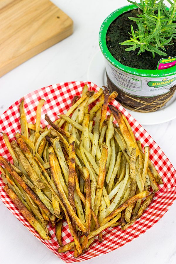 Thin-cut fries seasoned with fresh rosemary and garlic, these Rosemary Garlic Smashfries will become a favorite in your house!
