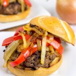 Break out the grill and serve up this Smoky Pepper and Onion Cheeseburger for dinner tonight!