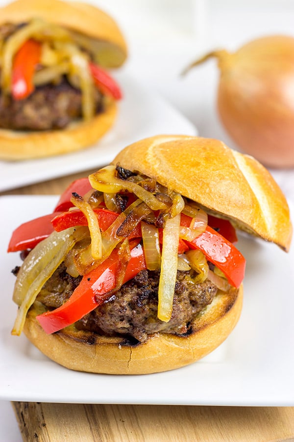Break out the grill and serve up this Smoky Pepper and Onion Cheeseburger for dinner tonight!
