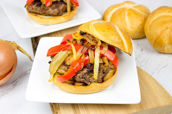 Break out the grill and serve up this Smoky Pepper and Onion Cheeseburger for dinner tonight!