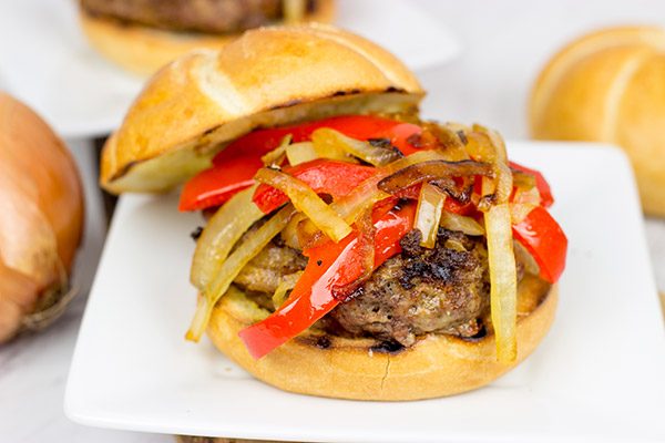 Break out the grill and serve up this Smoky Pepper and Onion Cheeseburger for dinner tonight!