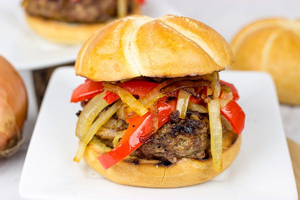 Break out the grill and serve up this Smoky Pepper and Onion Cheeseburger for dinner tonight!