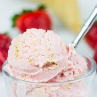 Fresh strawberries blended with cream cheese and yogurt, this Strawberry Cheesecake Frozen Yogurt is the perfect treat for summer evenings on the back porch!