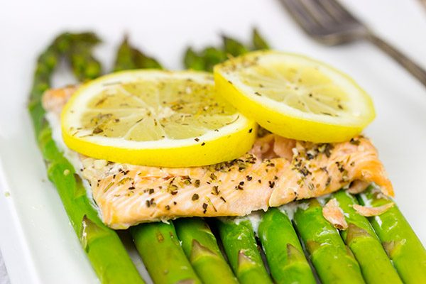 Baked all together in a foil packet, this Herbed Lemon Salmon is an easy (and healthy!) weeknight dinner idea.