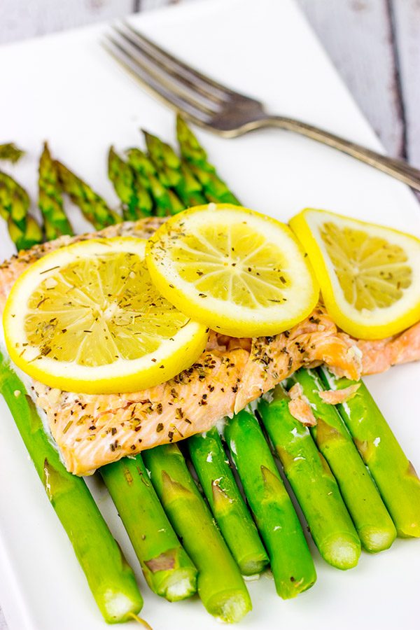 Baked all together in a foil packet, this Herbed Lemon Salmon is an easy (and healthy!) weeknight dinner idea.