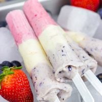 Celebrate the Fourth of July this year with these Red White and Blue Popsicles. They're the perfect cool treat on a hot summer day!
