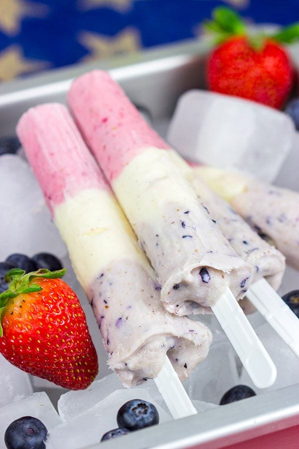 Celebrate the Fourth of July this year with these Red White and Blue Popsicles. They're the perfect cool treat on a hot summer day!