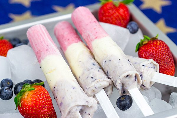 Celebrate the Fourth of July this year with these Red White and Blue Popsicles. They're the perfect cool treat on a hot summer day!