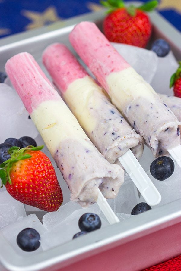 Celebrate the Fourth of July this year with these Red White and Blue Popsicles. They're the perfect cool treat on a hot summer day!