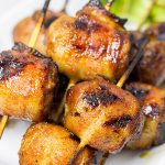 Whether in your backyard or at a picnic in the park, these Bacon-Wrapped Brats are perfect for summer grilling!