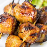 Whether in your backyard or at a picnic in the park, these Bacon-Wrapped Brats are perfect for summer grilling!