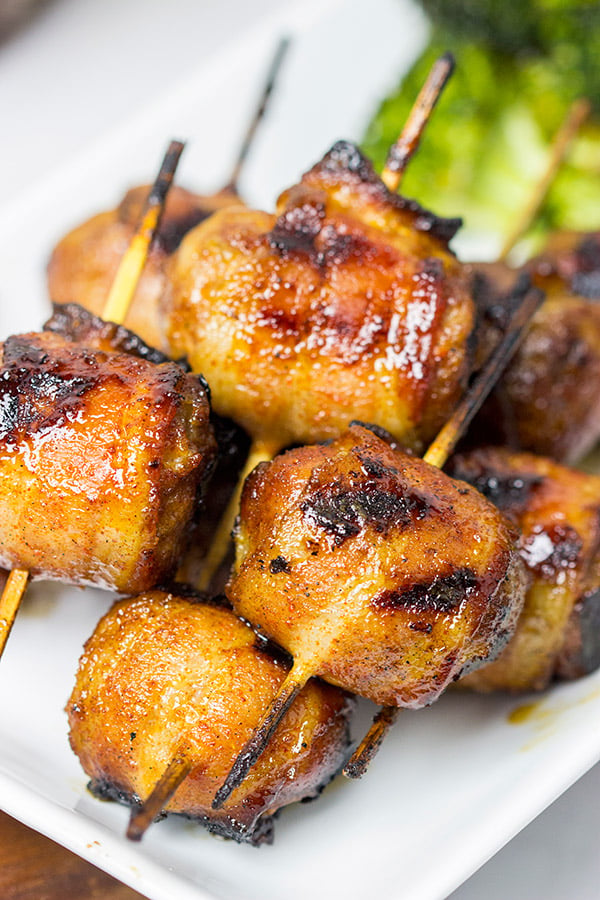 Whether in your backyard or at a picnic in the park, these Bacon-Wrapped Brats are perfect for summer grilling!