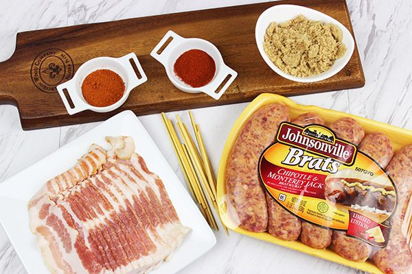 Whether in your backyard or at a picnic in the park, these Bacon-Wrapped Brats are perfect for summer grilling!
