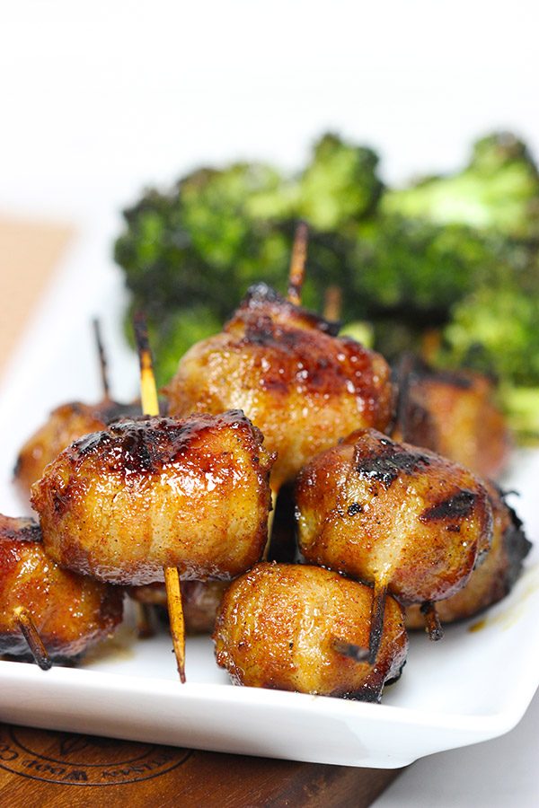 Whether in your backyard or at a picnic in the park, these Bacon-Wrapped Brats are perfect for summer grilling!
