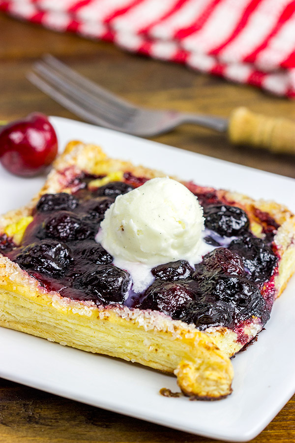 With layers of vanilla pastry cream and homemade cherry pie filling, these Vanilla Cherry Tarts make a great summer dessert!