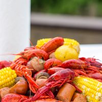Head to the backyard this weekend and host a Cajun Crawfish Boil with friends!