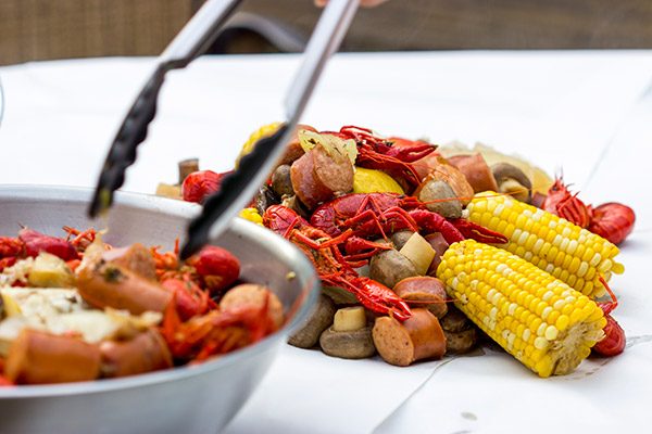 Head to the backyard this weekend and host a Cajun Crawfish Boil with friends!