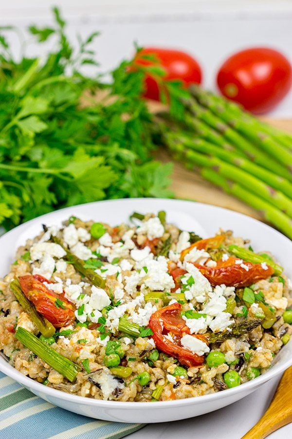 Looking for a healthy summer salad? Try roasting the tomatoes and asparagus! This Farro and Wild Rice Salad is quite tasty!