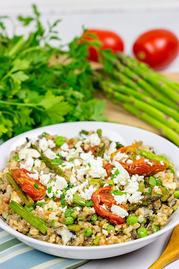 Looking for a healthy summer salad? Try roasting the tomatoes and asparagus! This Farro and Wild Rice Salad is quite tasty!