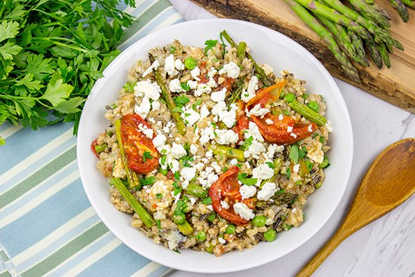 Looking for a healthy summer salad? Try roasting the tomatoes and asparagus! This Farro and Wild Rice Salad is quite tasty!