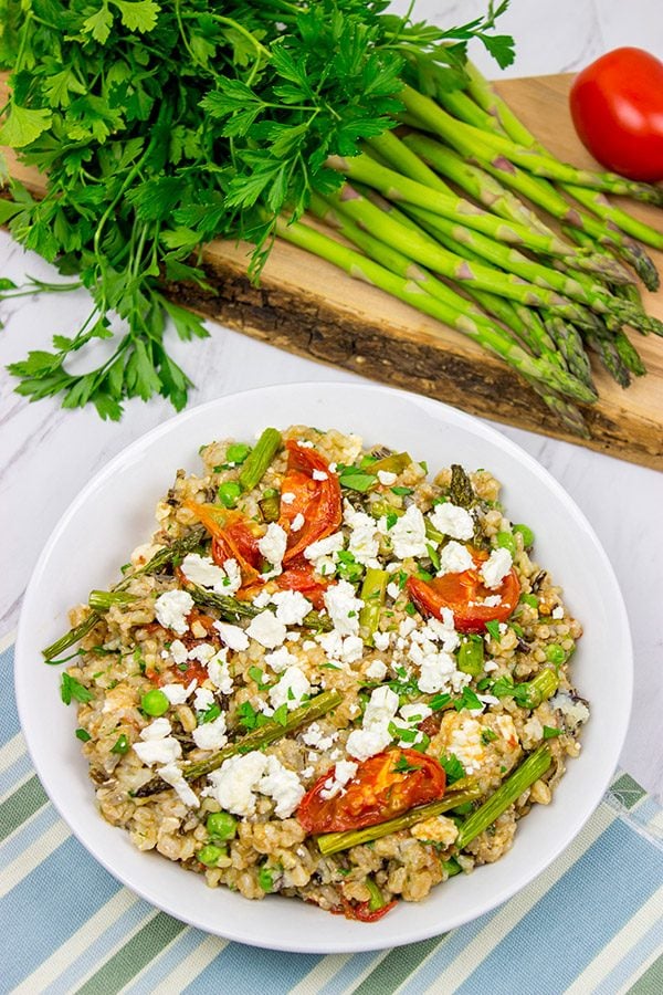 Looking for a healthy summer salad? Try roasting the tomatoes and asparagus! This Farro and Wild Rice Salad is quite tasty!