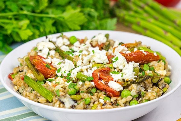 Looking for a healthy summer salad? Try roasting the tomatoes and asparagus! This Farro and Wild Rice Salad is quite tasty!