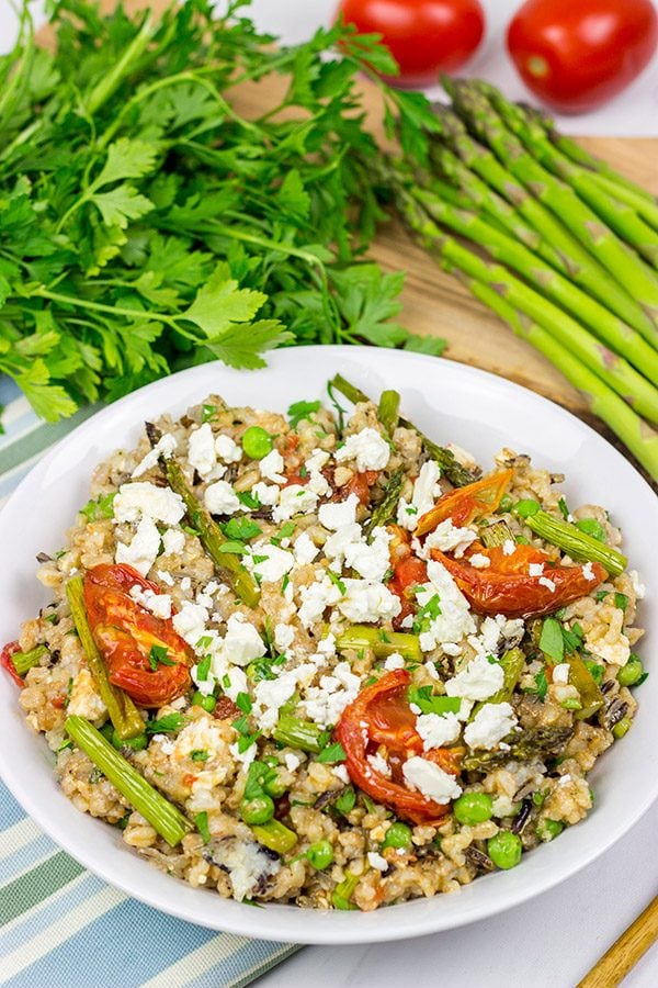 Looking for a healthy summer salad? Try roasting the tomatoes and asparagus! This Farro and Wild Rice Salad is quite tasty!