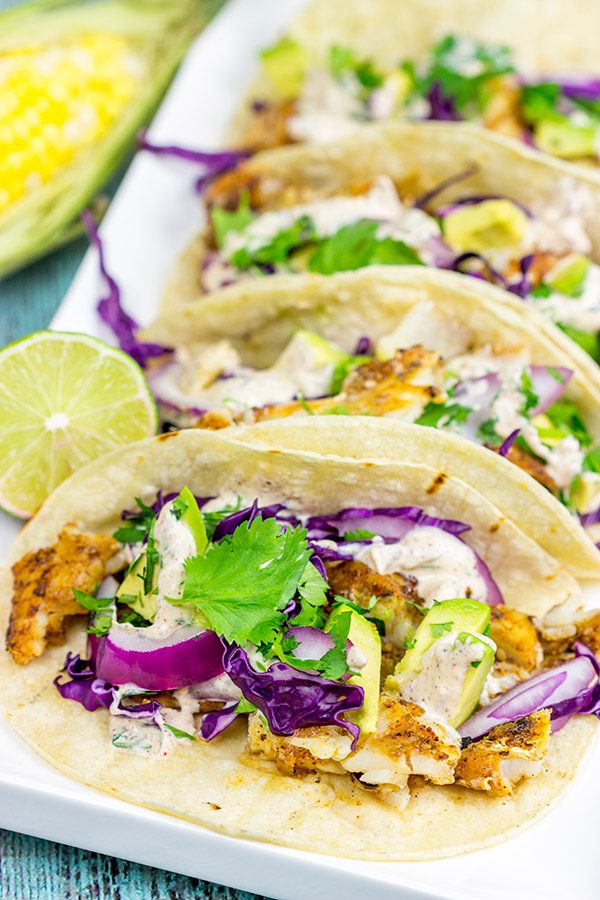 These Grilled Fish Tacos are packed with flavor...perfect for a summer dinner on the back porch!